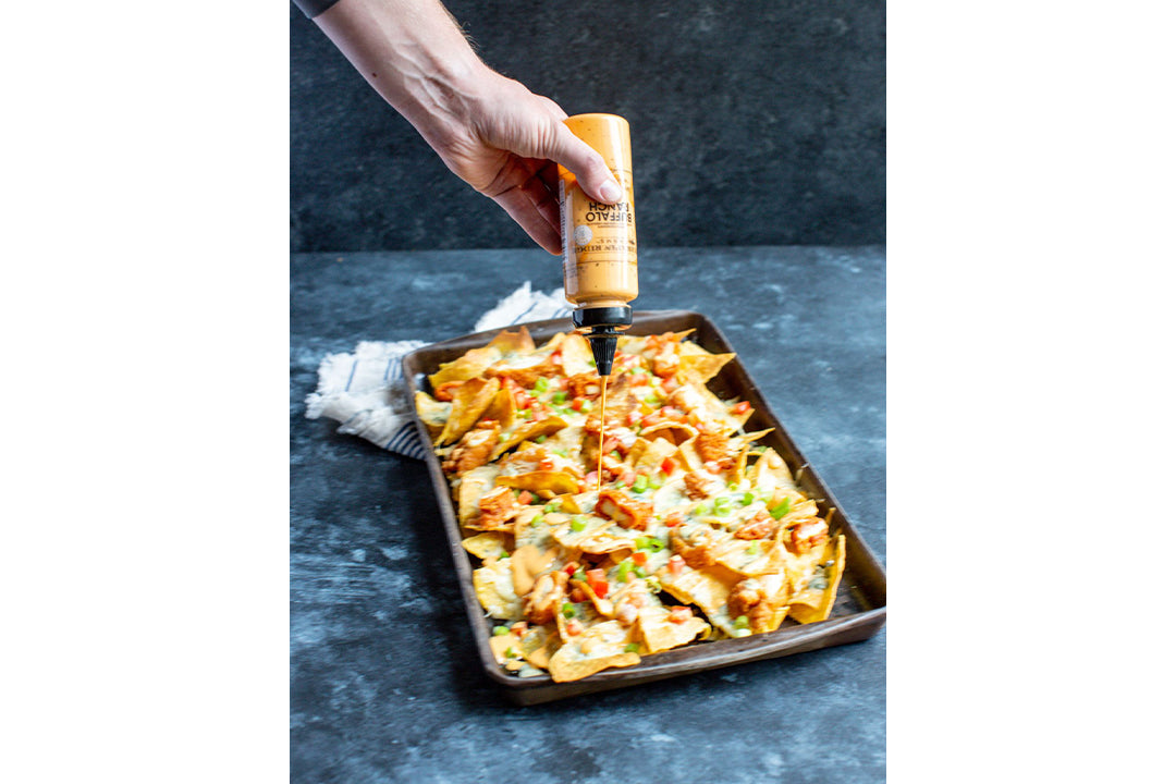 Buffalo Chicken Finger Nachos with Terrapin Ridge Farms Buffalo Ranch Garnishing Sauce Buffalo Chicken Finger Nachos with Terrapin Ridge Farms Buffalo Ranch Garnishing Sauce